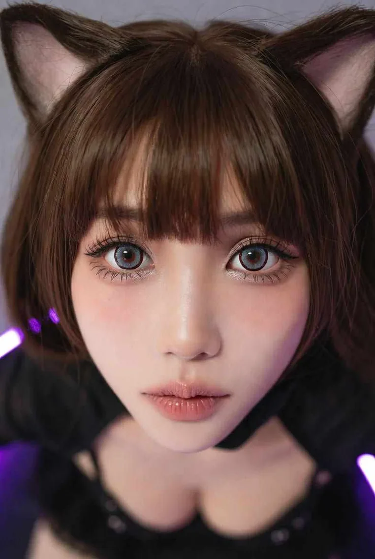 Yuki, an adult anime-style AI girlfriend character with brunette hair and cat-ear styling